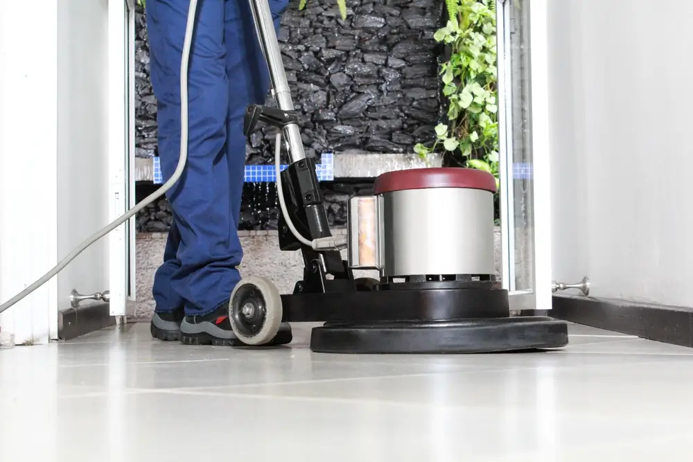 Polishing and waxing floors with machine
