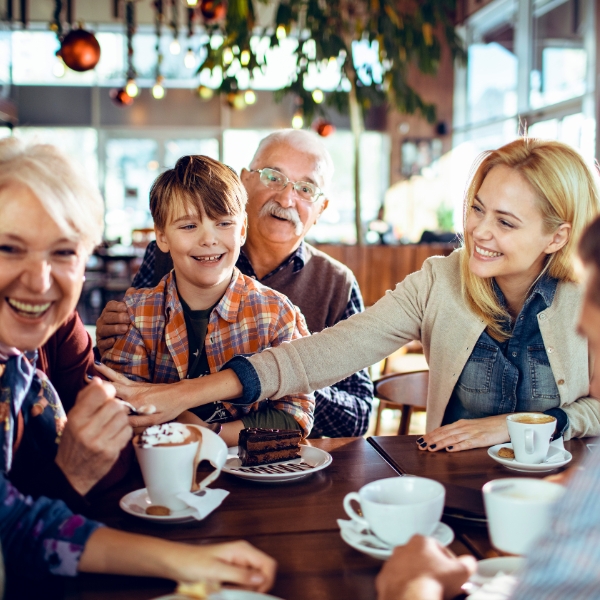 Happy Family out at a restaurant while their home is professionally cleaned