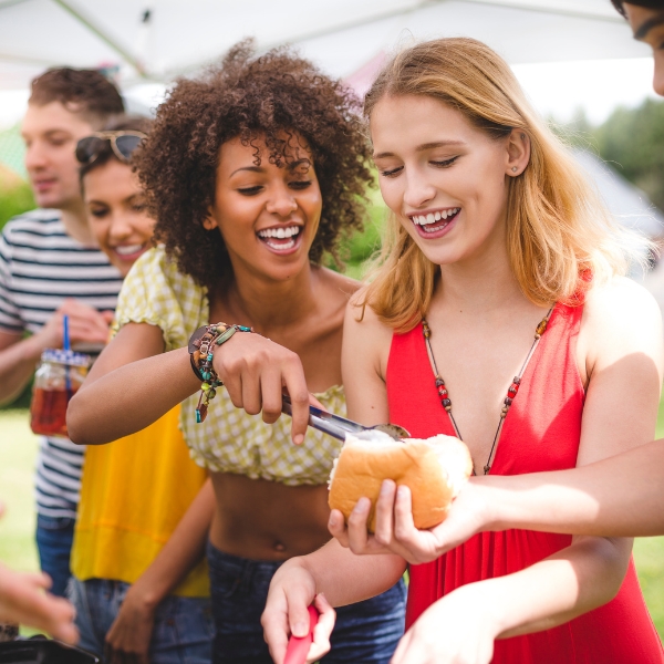 Friends enjoying bbq while their home is professionally cleaned